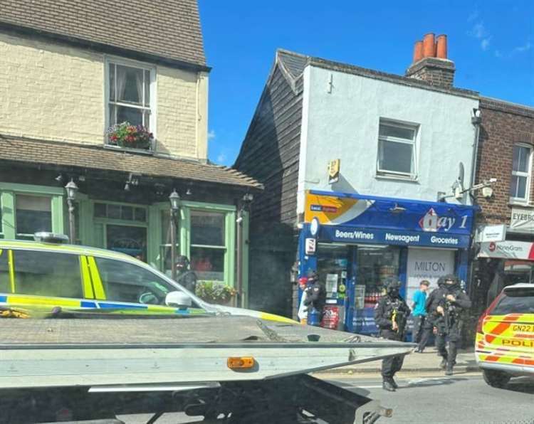 Armed police made two arrests. Photo Emily Cross