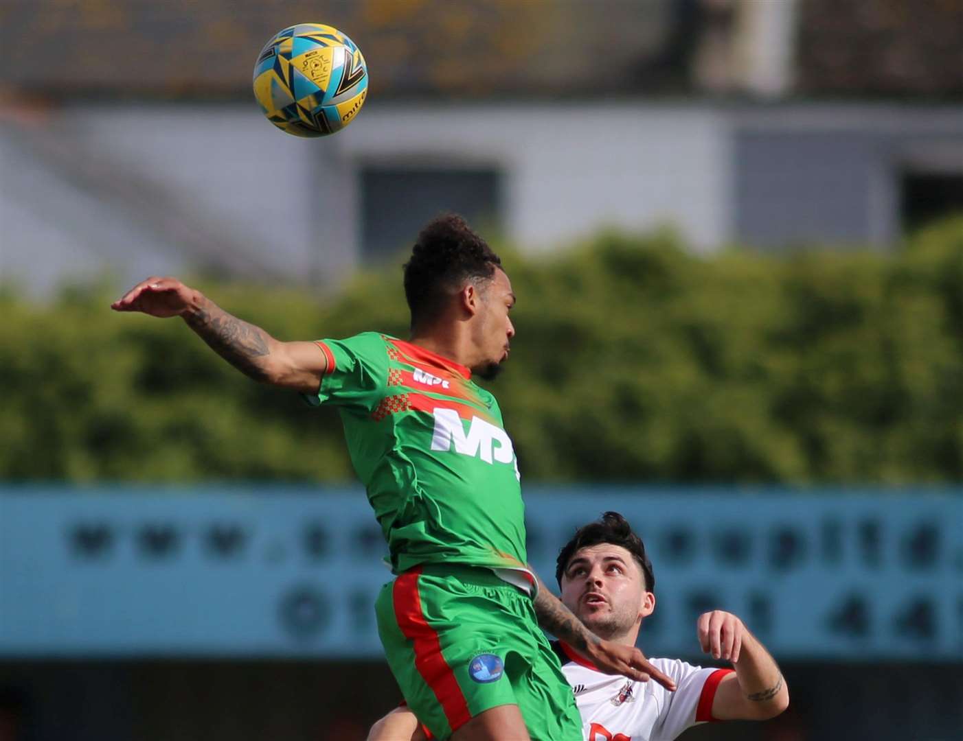 Lydd’s Troy Howard jumps high while wearing the MPR sports kit in a Southern Counties East Premier Division game at Deal last month. Picture: Paul Willmott