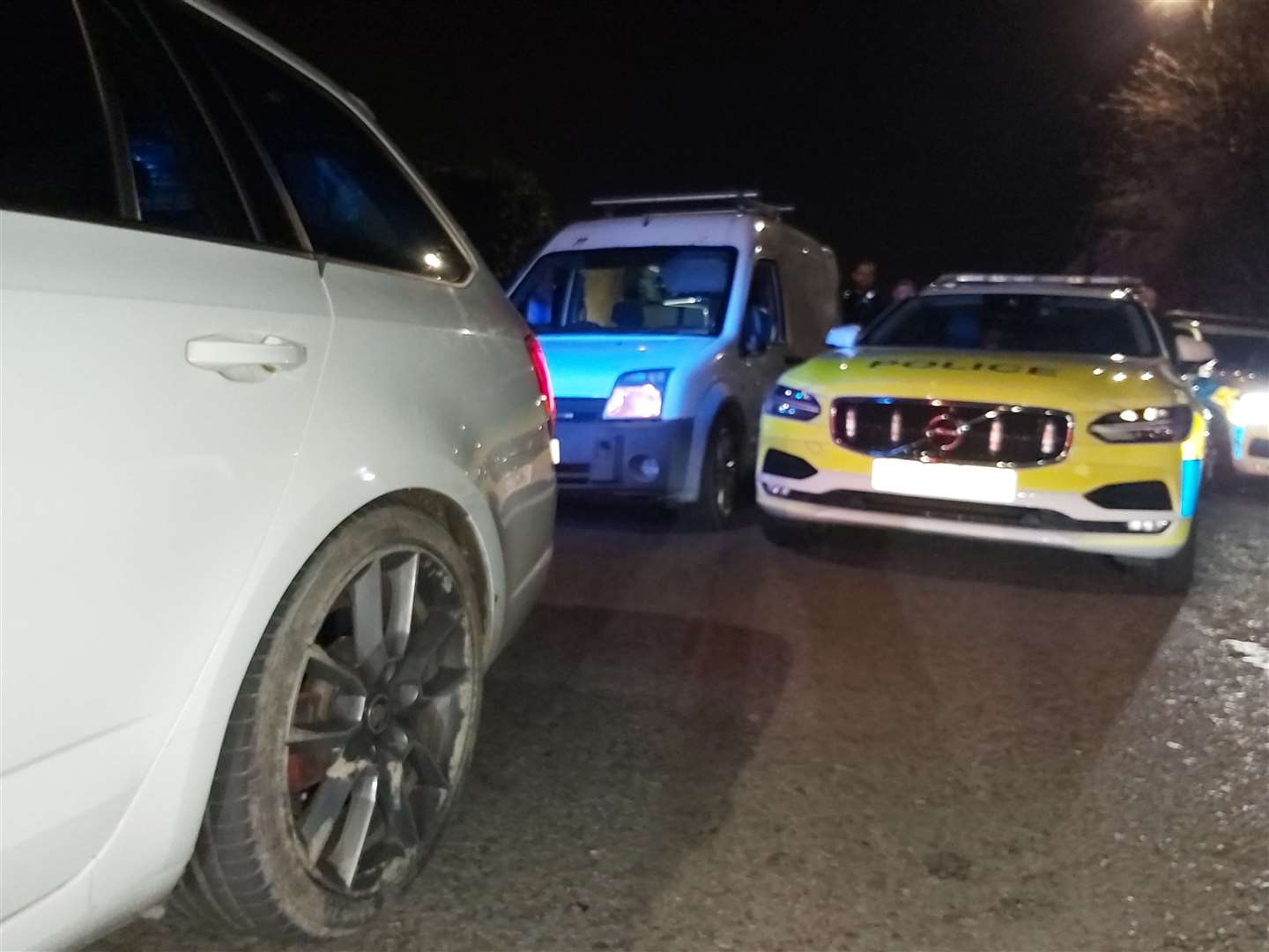 A white van reverse rammed into a police car in an attempt to get away