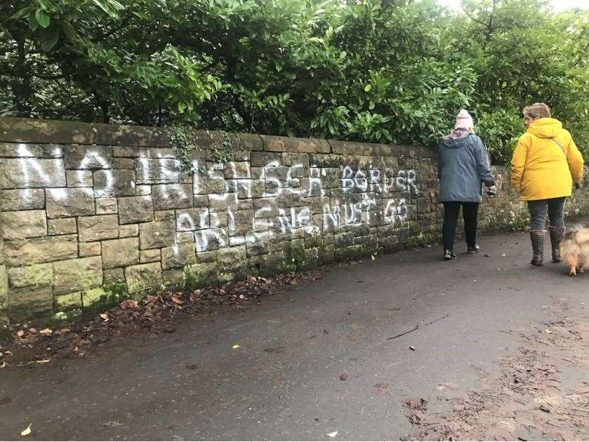 Graffiti painted on a wall in east Belfast earlier in January saying First Minister Arlene Foster “must go”, referencing the Irish Sea border (Rebecca Black/PA)