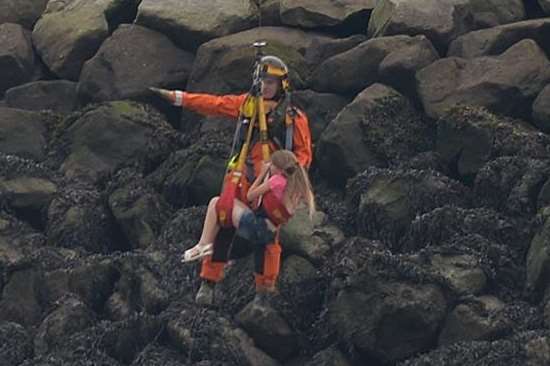 Girl winched to safety. Pic: Michael McLaughlin