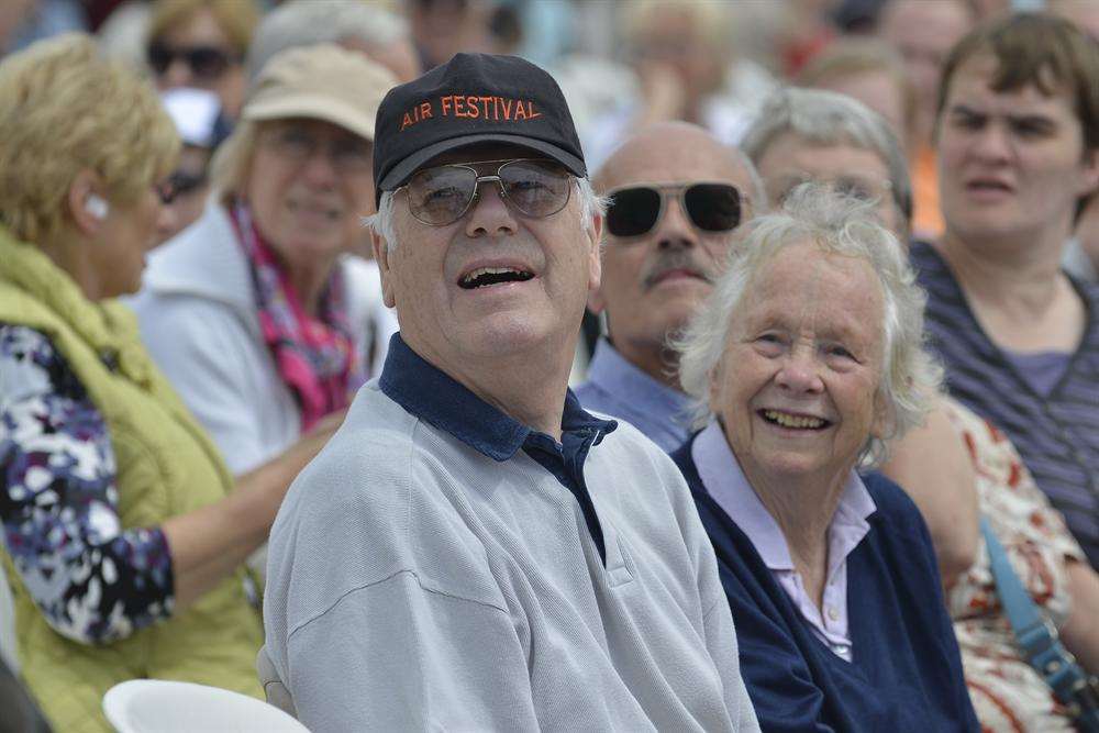 Crowds watch the stunt of the Red Arrows at Folkestone Airshow.