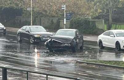 The black saloon suffered heavy damage in the crash. Picture: Colin Walker