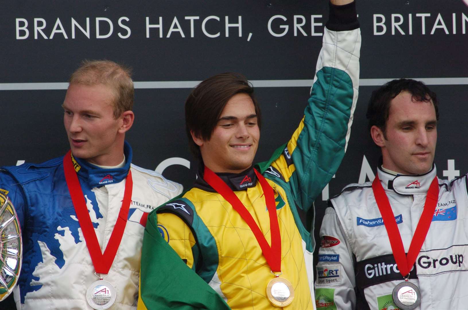 Frenchman Alexandre Premat and New Zealand's Matt Halliday alongside race winner Nelson Piquet Jr in 2005. "I'm not racing for myself but for my country – A1 is going to be huge," Piquet Jr said afterwards. Picture: Barry Goodwin