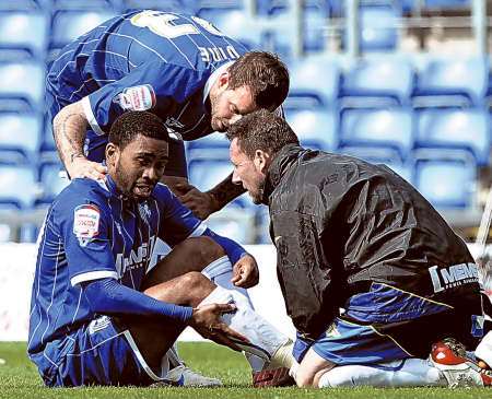 Gavin Tomlin gets treatment before eventually being replaced by Danny Spiller