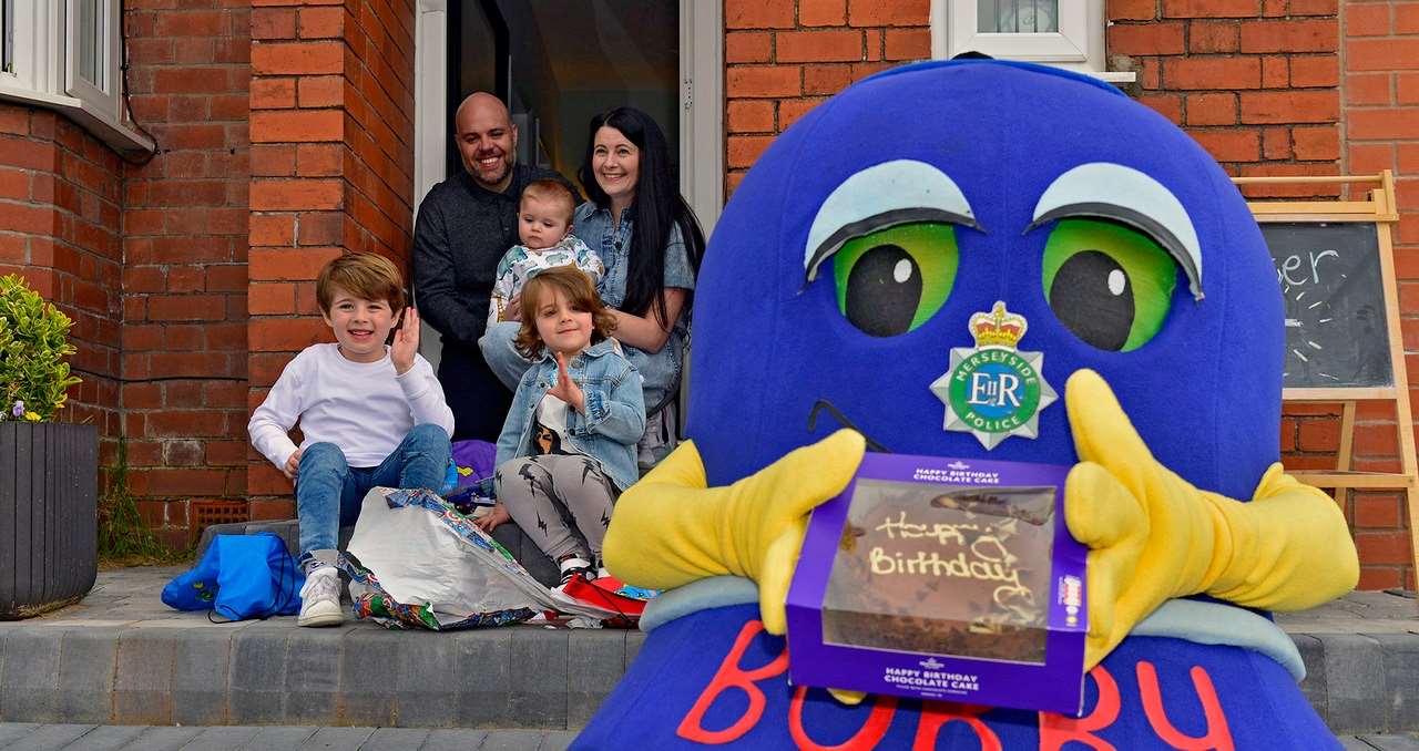 Dexter Lee with parents Anna and Rob Lee, big brother Freddie, baby brother Mason and force mascot Bobby (Merseyside Police/PA)