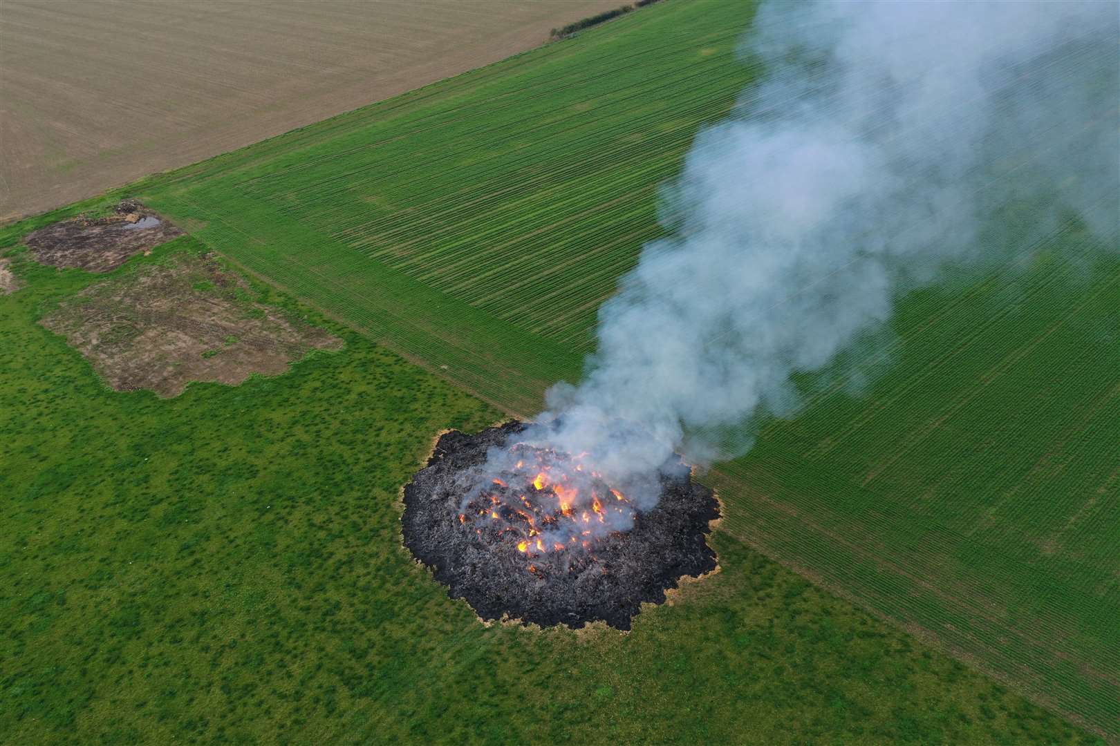 Firefighters were called to haybales alight on land near Cooling last night. Picture: UKNIP