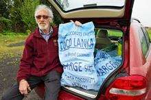 Bob, with bags of coconuts which were bought for the show.