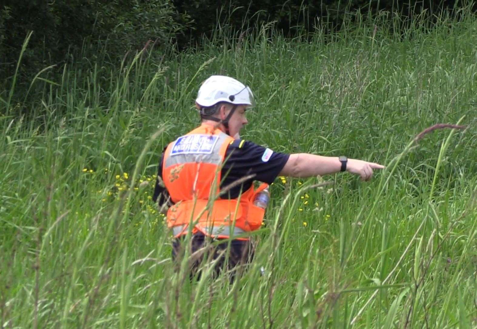 Community Rescue Service volunteers in thick undergrowth on the banks of the River Braid (PA)