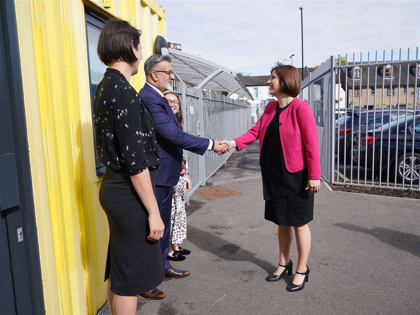 Education Secretary Bridget Phillipson meeting Shiraz Khan, principle, alongside Molly Devlin, headteacher, (3rd left) and Katie Oliver, Director of Ark Start, (left) during her visit to a nursery at Ark Start Oval, East Croydon (Yui Mok/PA)