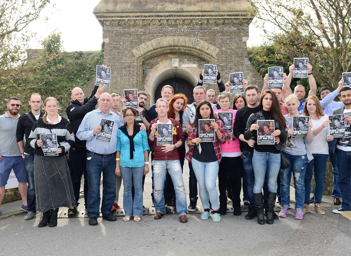 Friends and family of Fred Buenavista protest against the decision to deport him