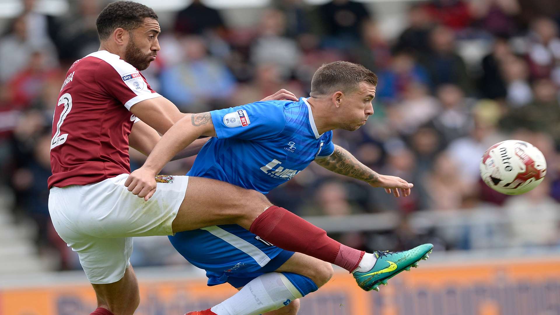 Cody McDonald battles Northampton's Lewin Nyatanga Picture: Ady Kerry