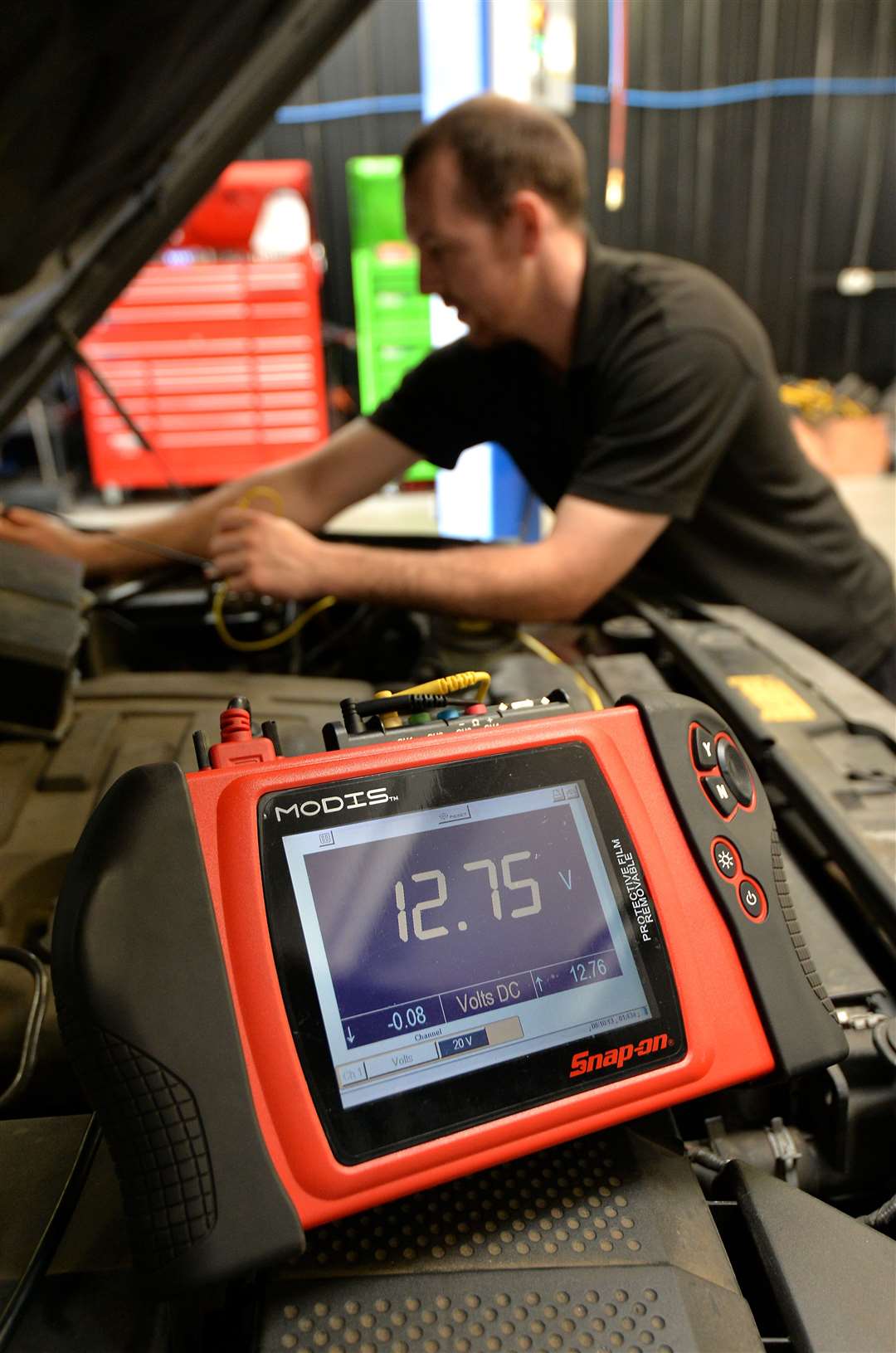 A mechanic checks the health of a car battery (Andrew Matthews/PA)