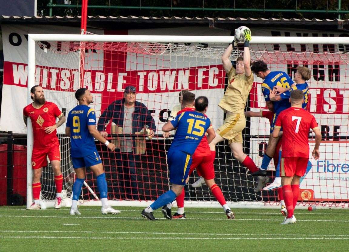 Whitstable Town goalkeeper Dan Colmer claims a cross during their FA Vase win over Hollands & Blair. Picture: Les Biggs