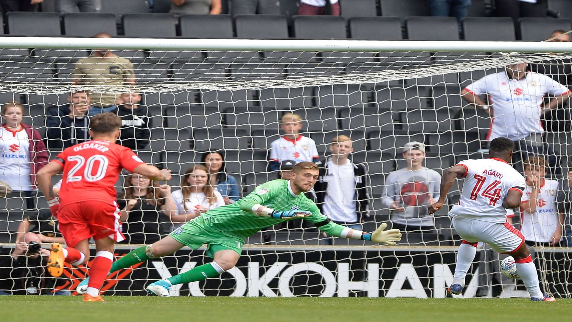 Gills keeper Tomas Holy saves a penalty against MK Dons. Picture: Ady Kerry