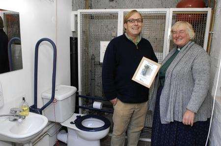 Rev Tricia Fogden and Will Rolston with the certificate twinning the church loo with one in Gambia