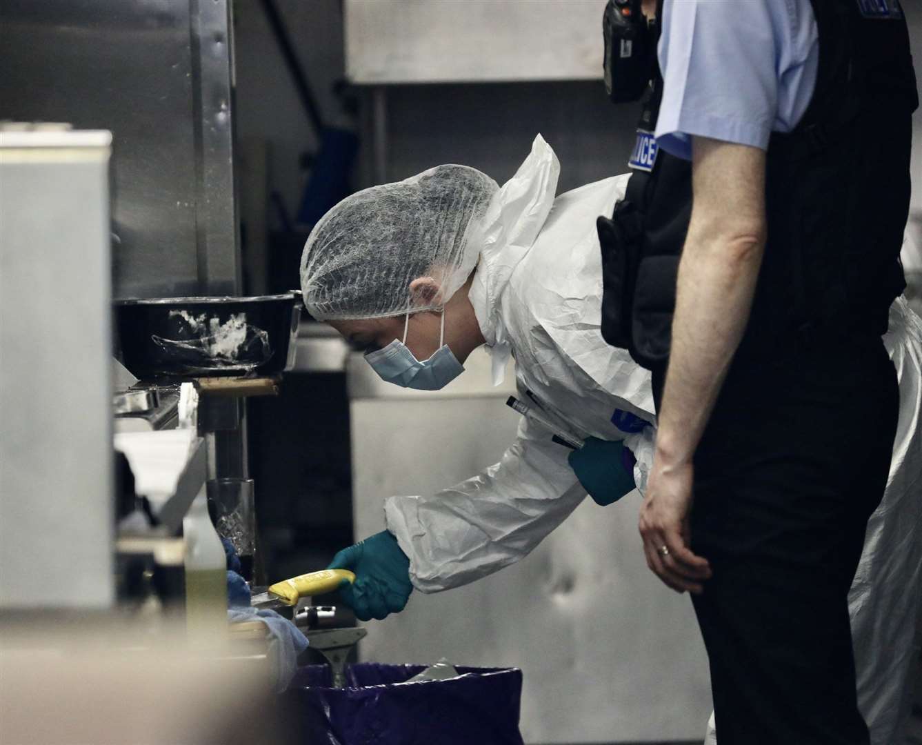 Forensic officer at the scene of the incident at Sunshine Cafe in High Street, Hythe. Picture: UKNiP