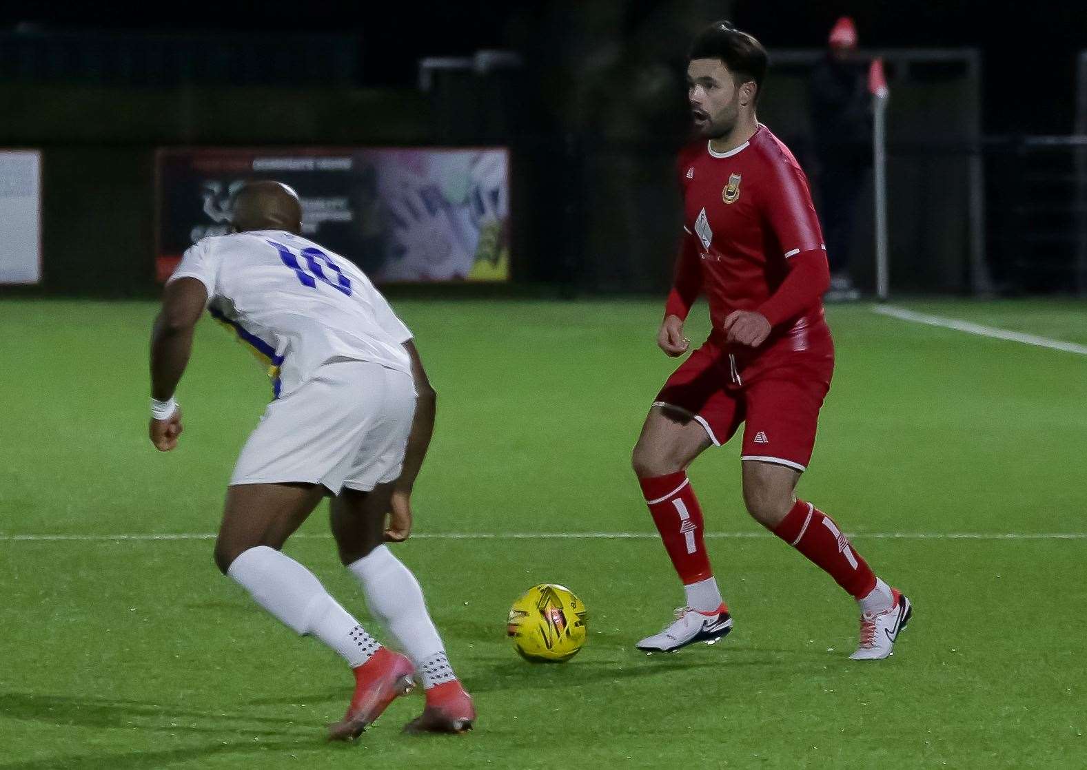 Whitstable left-back George Sheminant takes on Francis Babalola during Tuesday’s 3-1 win over Snodland. Picture: Les Biggs