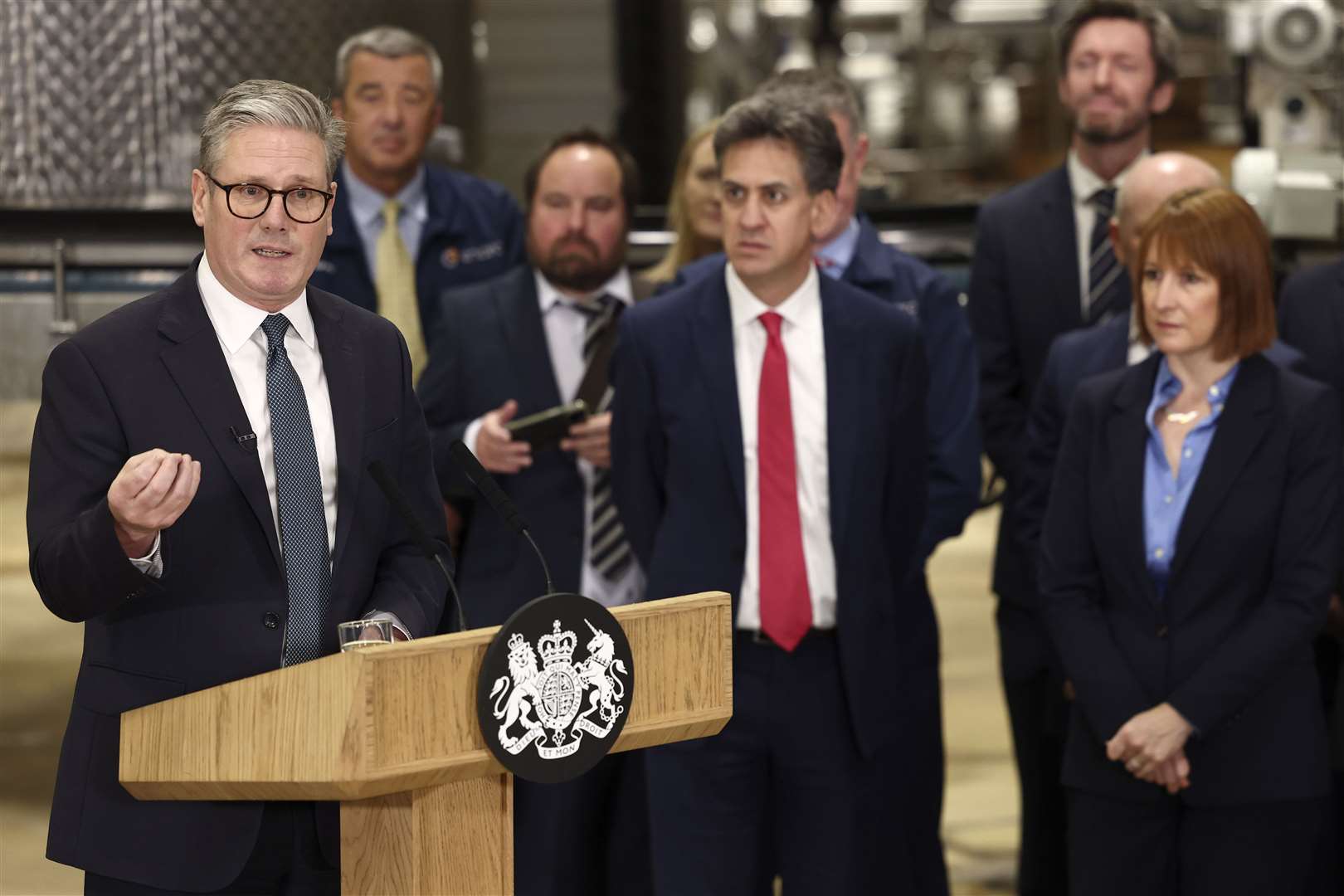 Prime Minister Keir Starmer speaks as Chancellor Rachel Reeves and Energy Secretary Ed Miliband listen during a visit to a manufacturing facility in Chester (Darren Staples/PA)