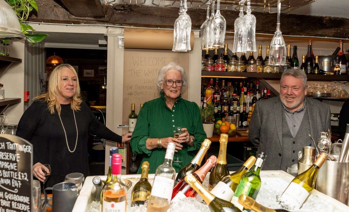 Yvonne Neame (centre) officially reopens The White Horse alongside Sharon and Gordon Thompson. Picture: Shepherd Neame