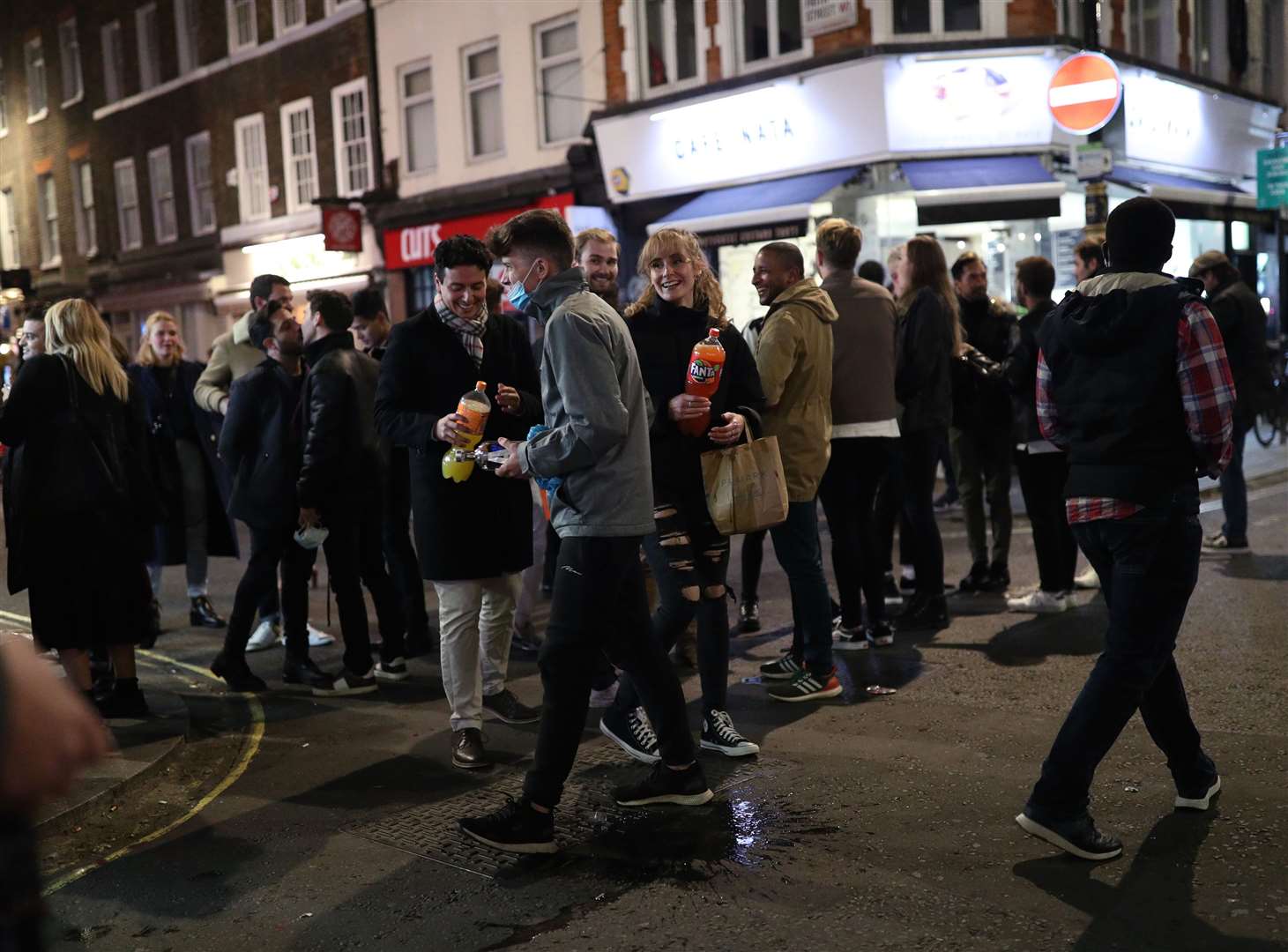 People in Soho, London, on Saturday night after pubs and restaurants were subject to a 10pm curfew (Yui Mok/PA)