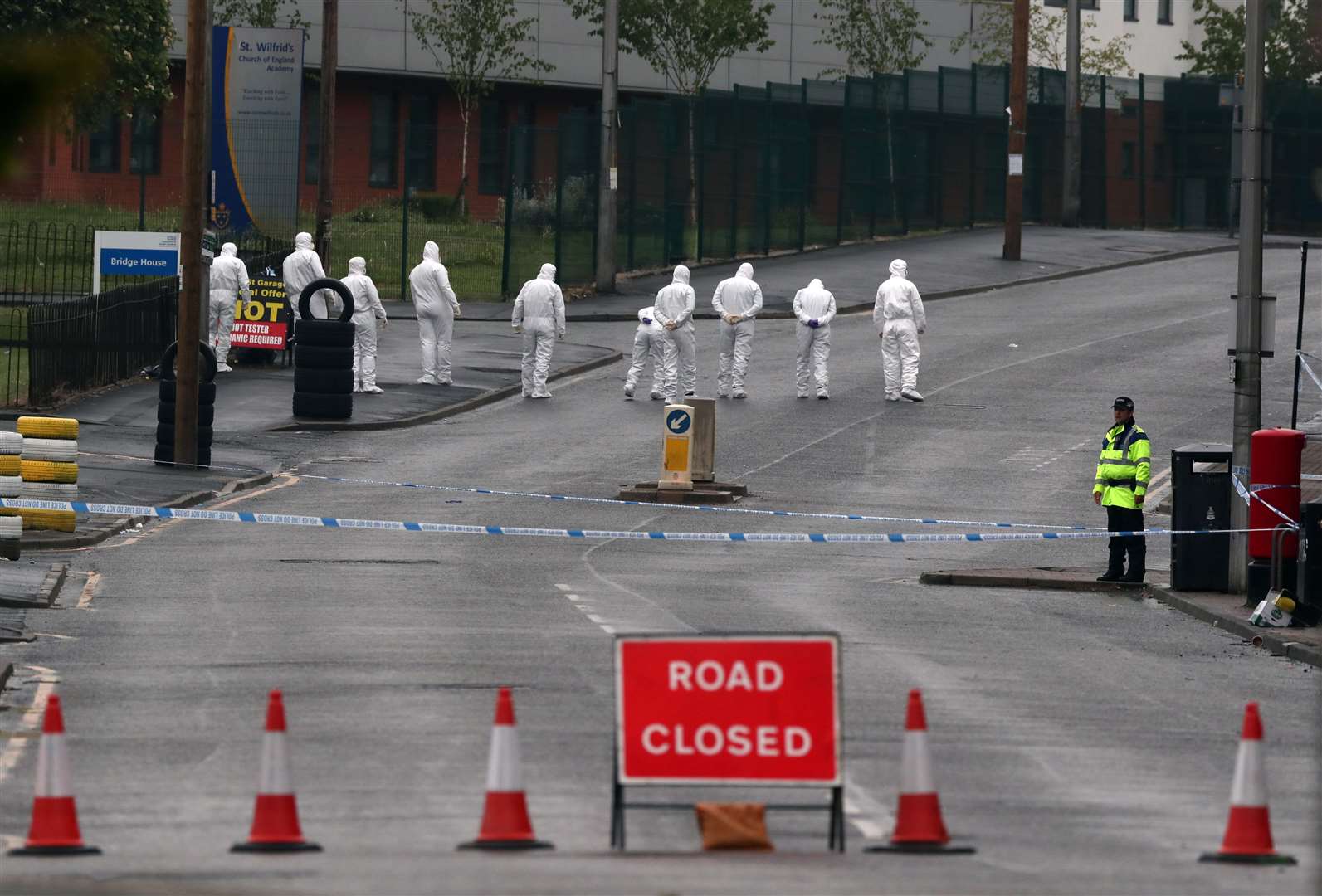 Police officers at the scene on King Street, Blackburn, following the shooting of law student Aya Hachem (Peter Byrne/PA)