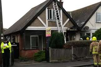 The house was damaged by flames and smoke