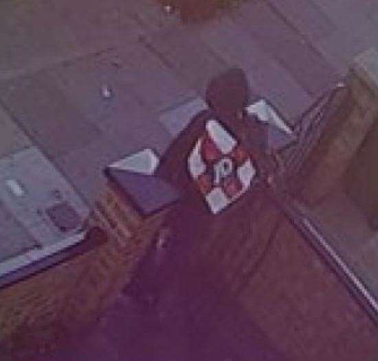 CCTV of Lane leaving the address in Abbey Wood with the goods in a JD sports bag. Photo: Metropolitan Police