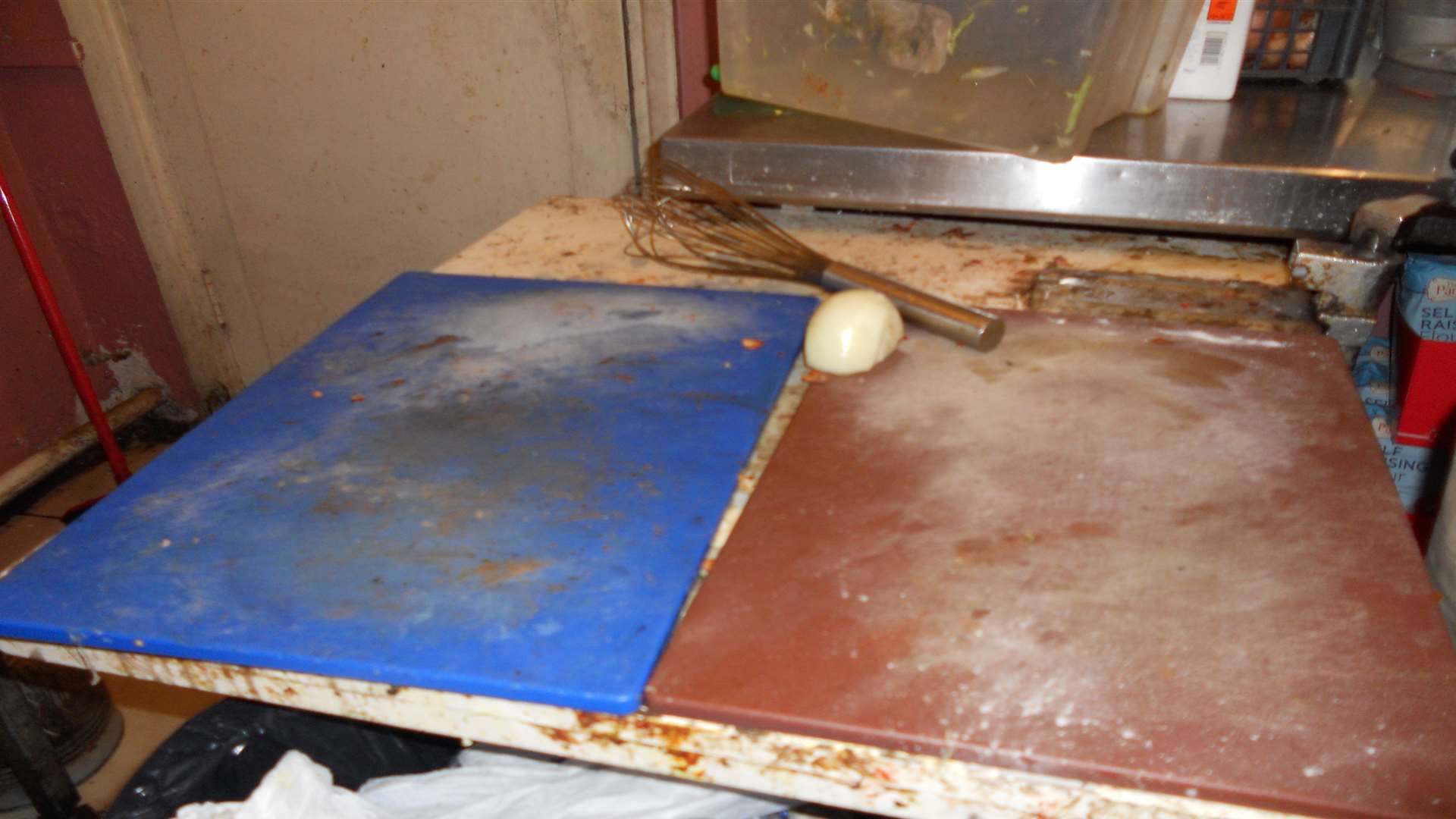 Inspectors look at the cleanliness of surfaces and appliances during their a to a food outlet