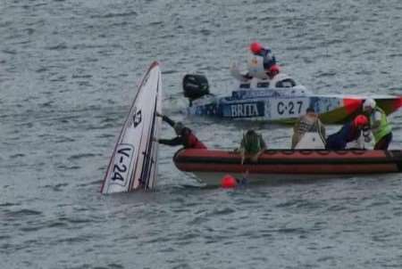 The power boat with its nose pointing up out of the sea. Picture: MIKE PETT