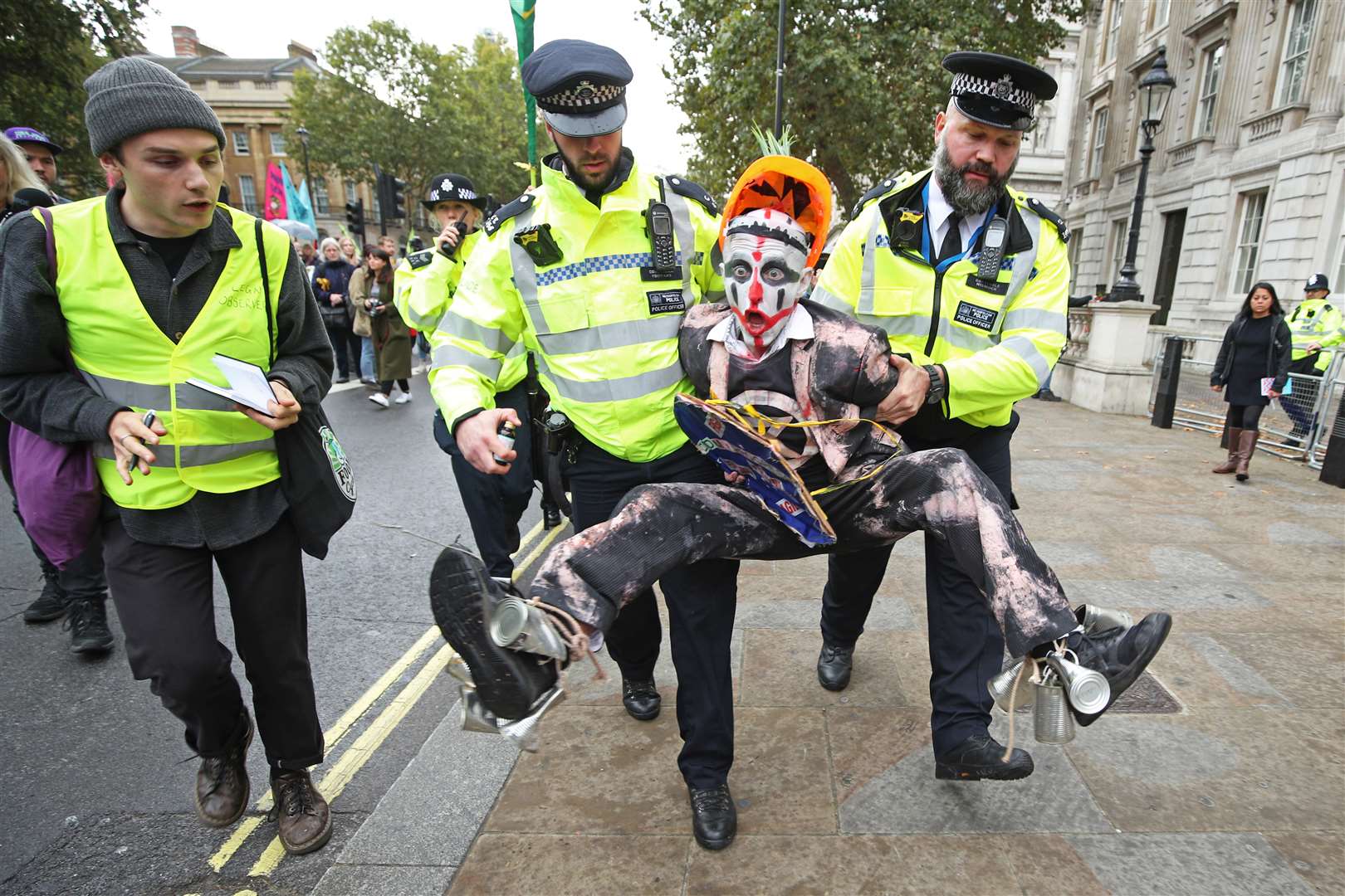 Yui Mok’s picture of police holding a protester during an Extinction Rebellion demonstration was praised by the judges (Yui Mok/PA)