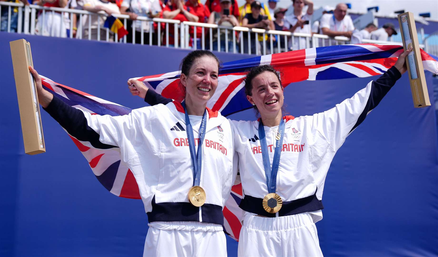 Emily Craig and Imogen Grant celebrate with their gold medals during the ceremony for the lightweight women's double sculls finals at the Vaires-sur-Marne Nautical Stadium. Picture: John Walton/PA Wire