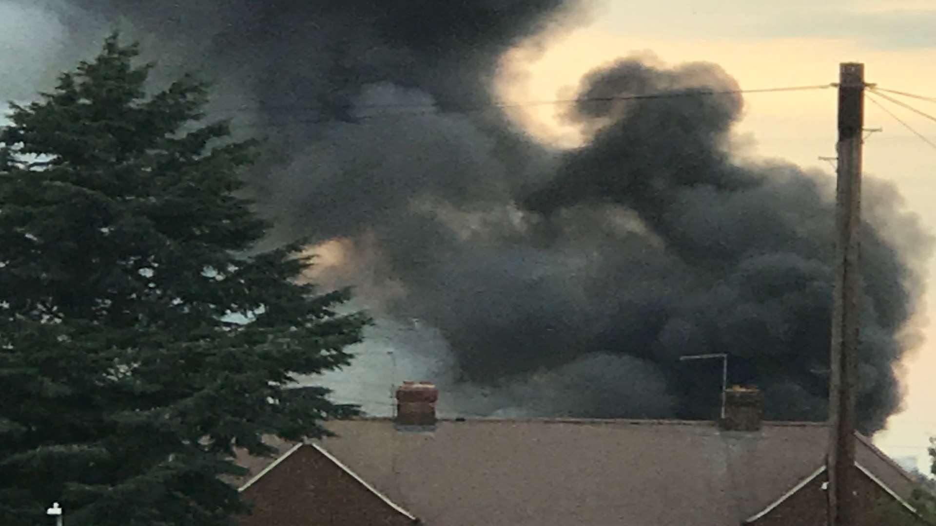 Thick black smoke fills the sky. Picture: Alex Deakin