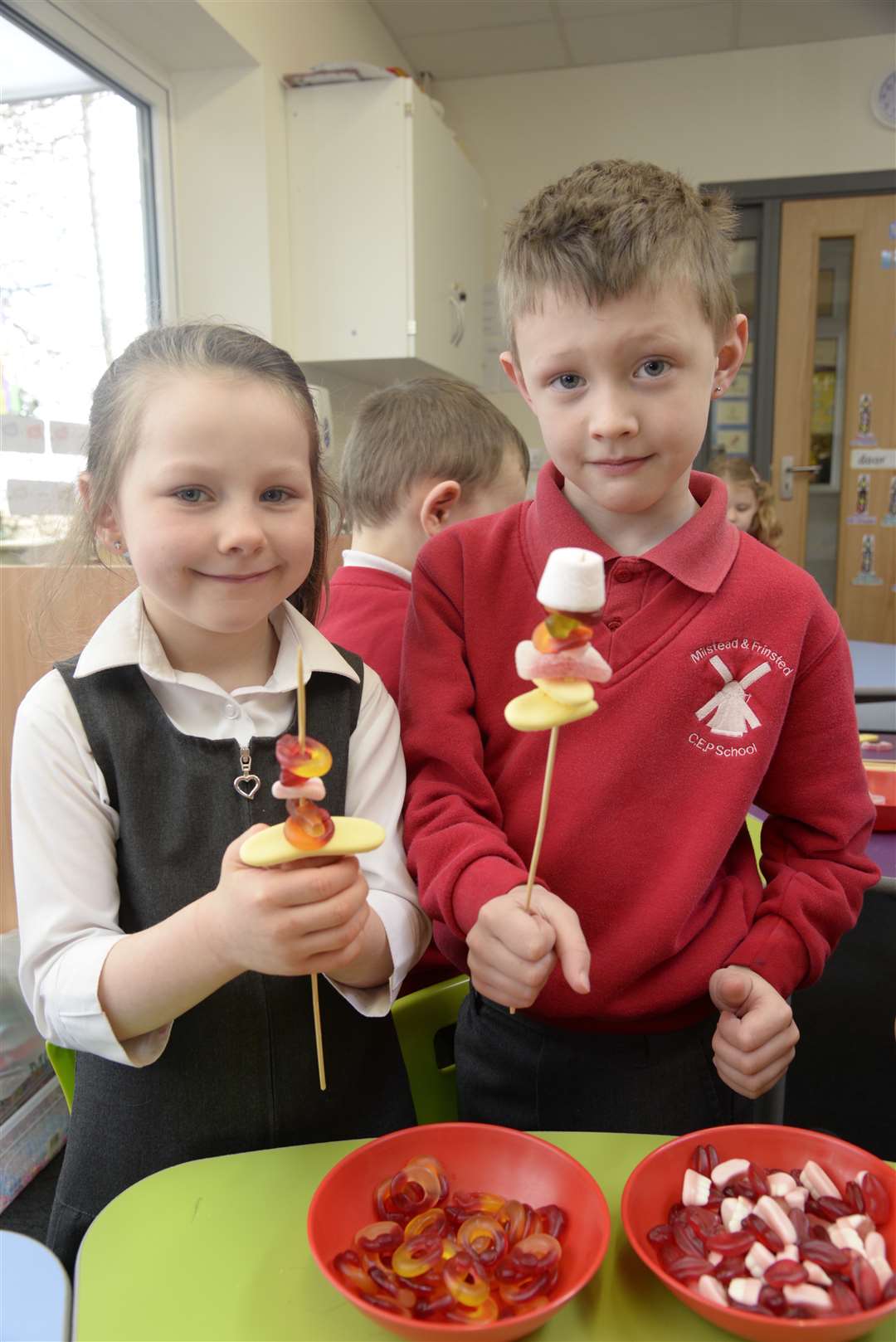 Sienna and Charlie, both five, make goodies for the sale