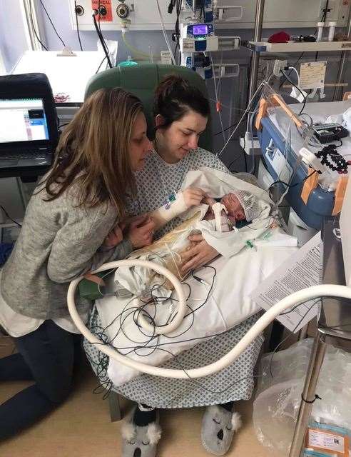 Baby Oscar Parodi is pictured with his mother Chelsea Parodi and grandmother Christine Bell (NNUH/PA)