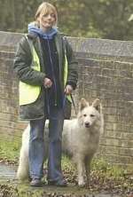 Judy Yordanov out searching for missing Weasel with her last remaining German shepherd, Jessie. Picture: DAVE DOWNEY