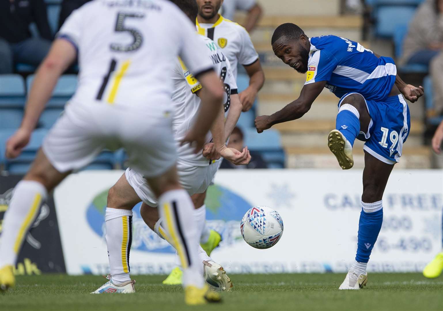 Gillingham winger Mark Marshall shoots through the massed ranks of the Burton defence Picture: Ady Kerry