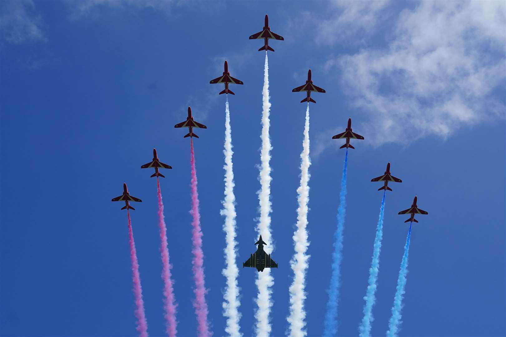 The Red Arrows perform a flypast during the UK national commemorative event at the British Normandy Memorial in Ver-sur-Mer (Jane Barlow/PA)