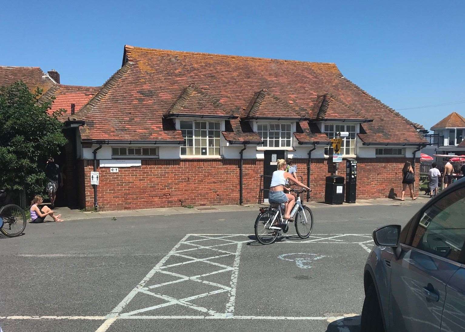 The public toilets are next to the car park