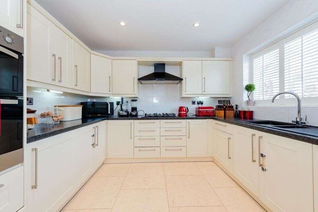 The kitchen also has french doors leading out to the back garden