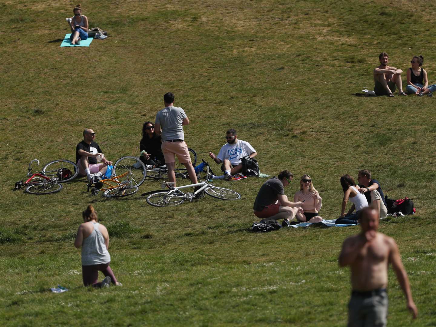 Sunbathers in Greenwich Park, London (Yui Mok/PA)