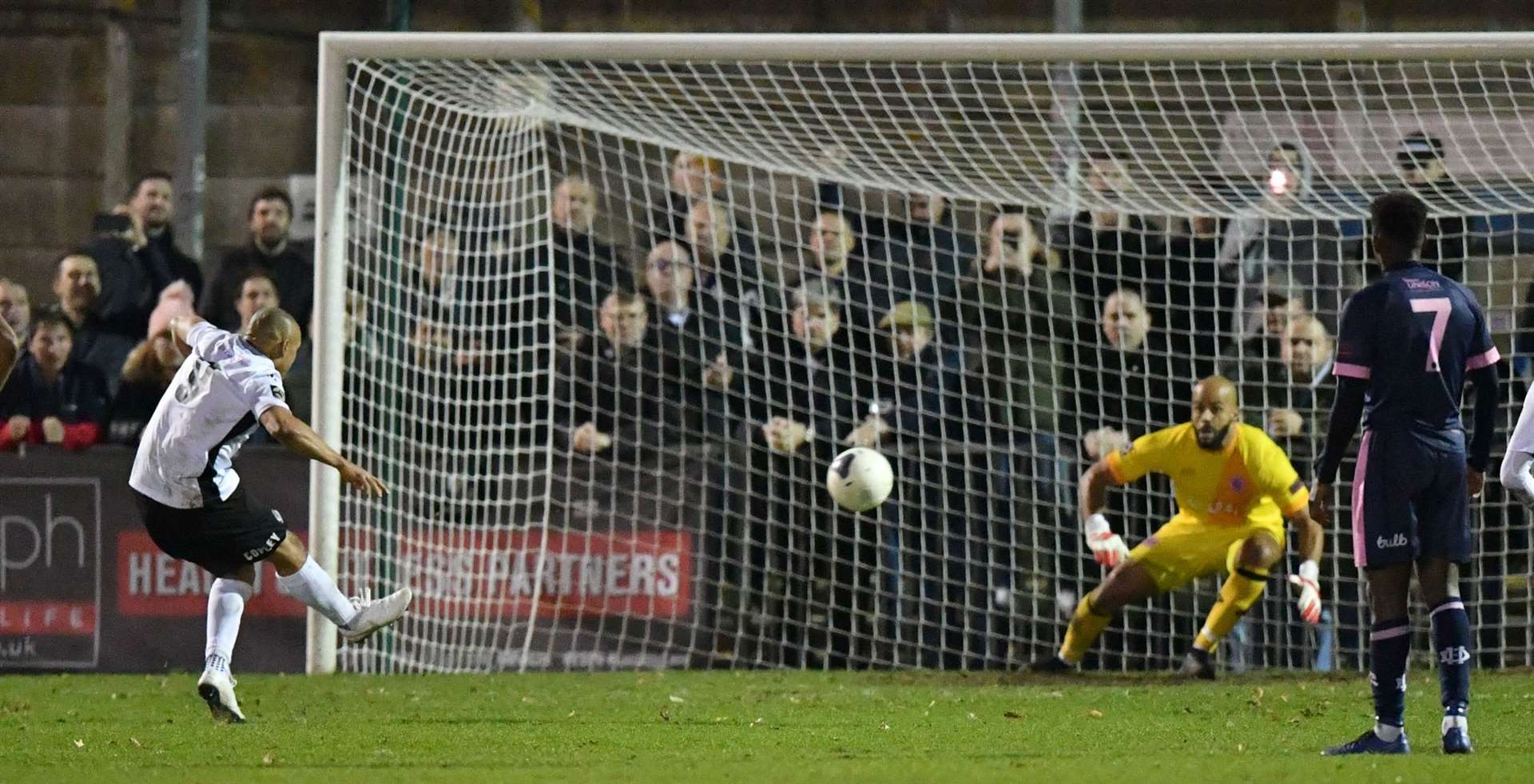 Elliott Romain converts from the penalty spot for Dartford at Dulwich. Picture: Keith Gillard