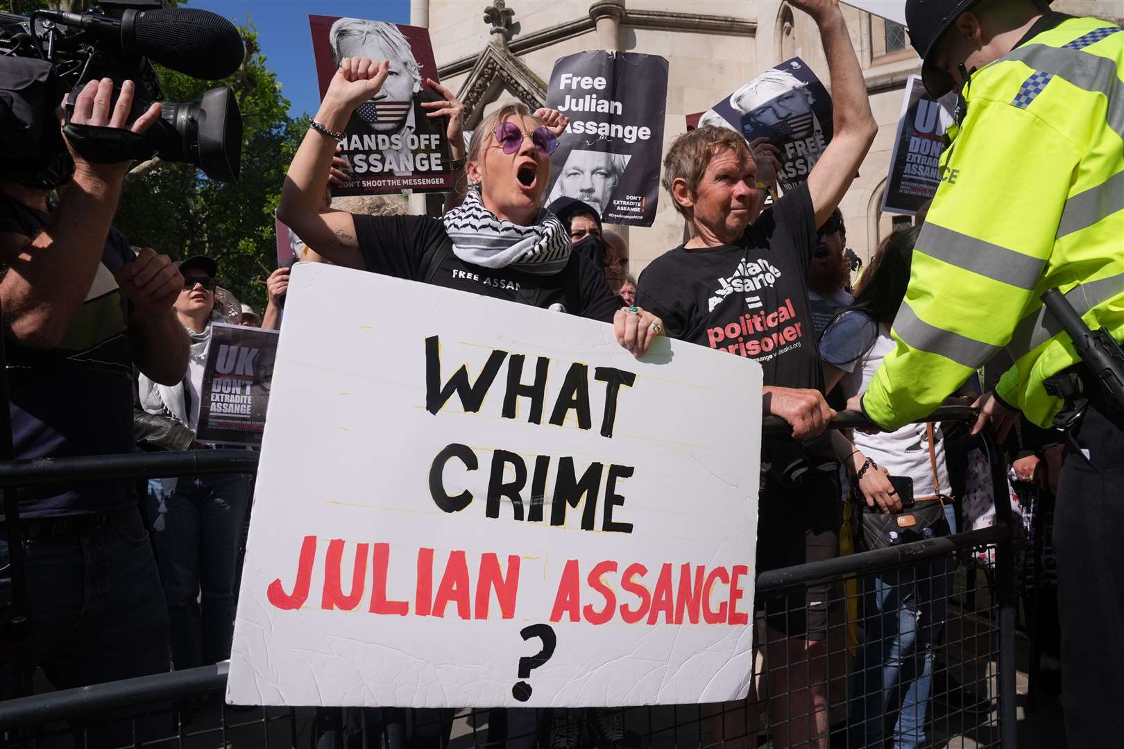 Supporters of Julian Assange outside the Royal Courts of Justice in London (Lucy North/PA)