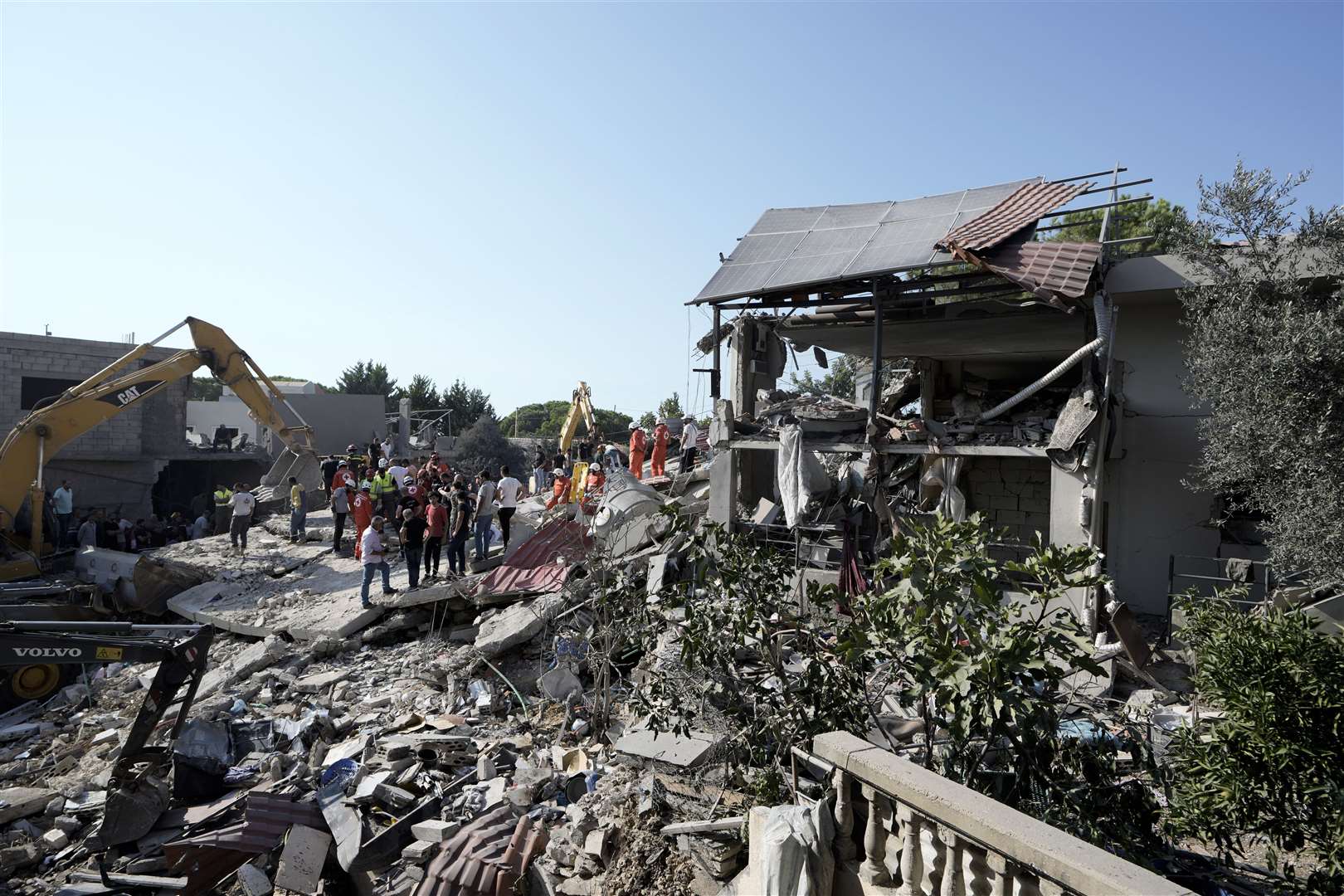 Emergency workers arrive at the scene of an Israeli airstrike in the town of Maisara, north of Beirut, on Wednesday (Bilal Hussein/AP)