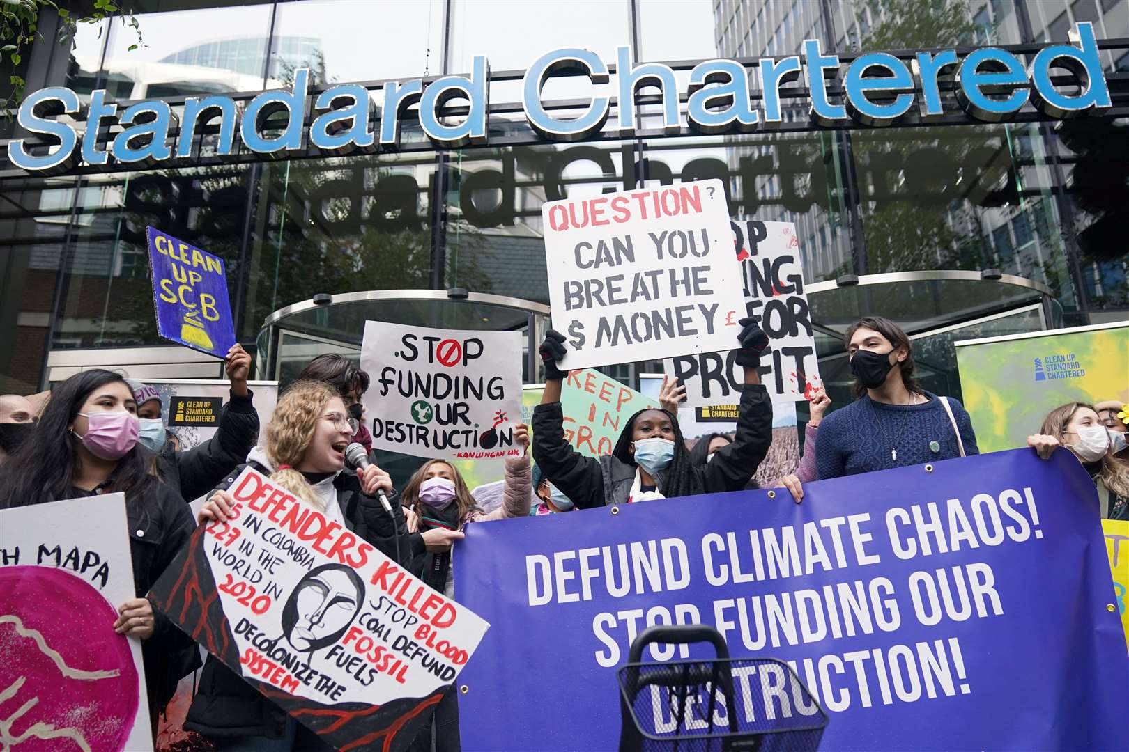 Activists outside Standard Chartered in London (Victoria Jones/PA)