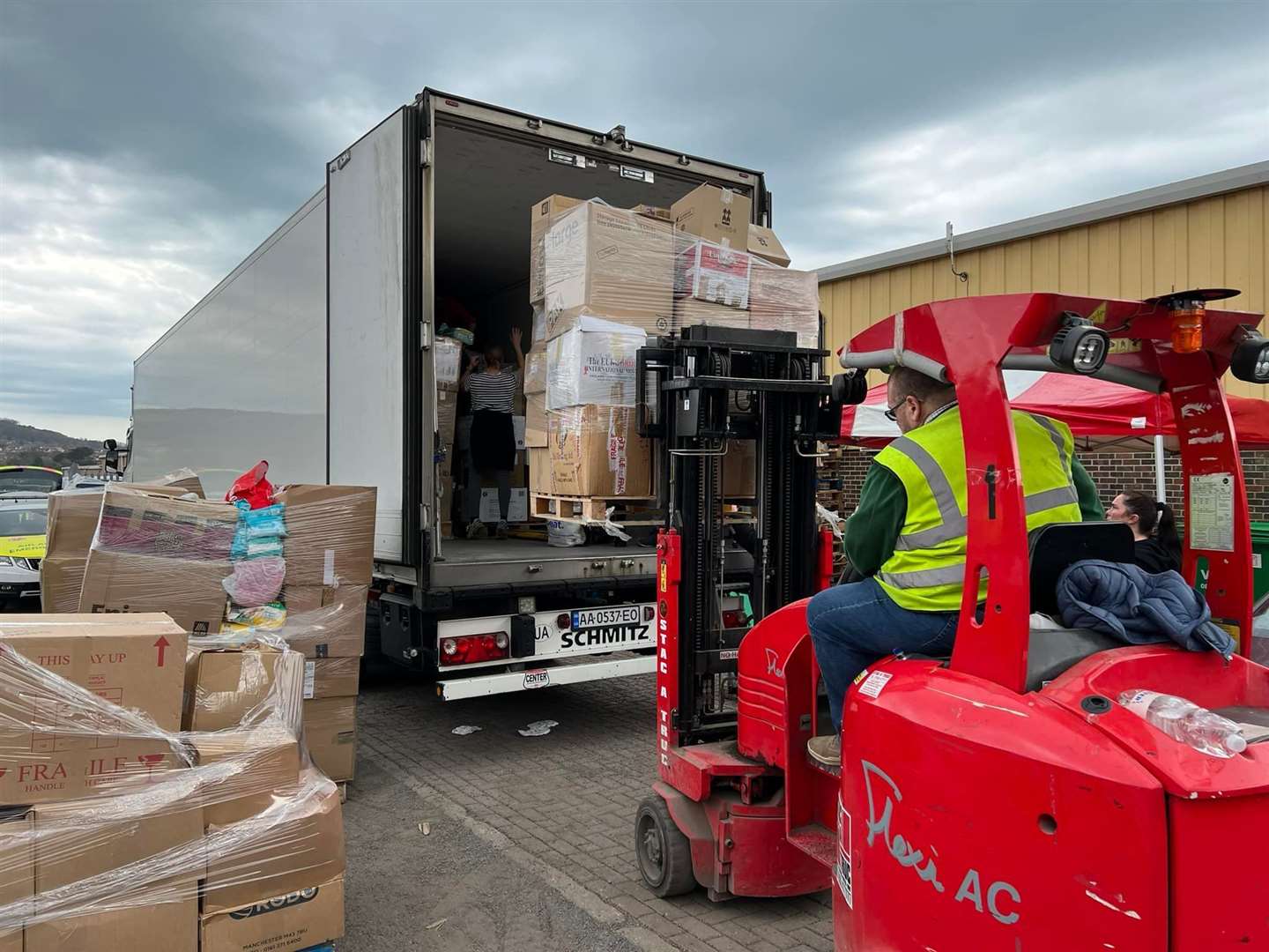 HGV's are loaded with donations from the container in Folkestone