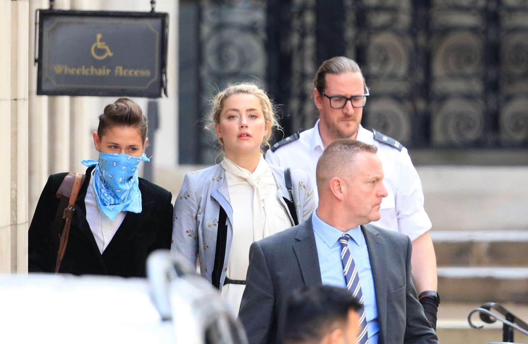 Actress Amber Heard leaves the High Court (Aaron Chown/PA)