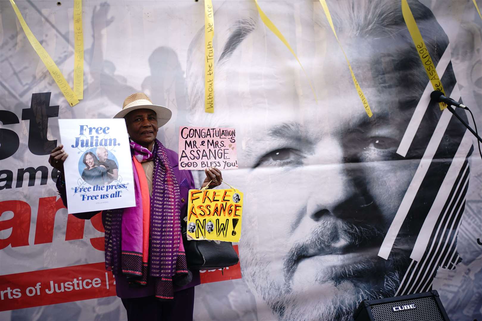 Supporters of WikiLeaks founder Julian Assange celebrate his wedding (Yui Mok/PA)