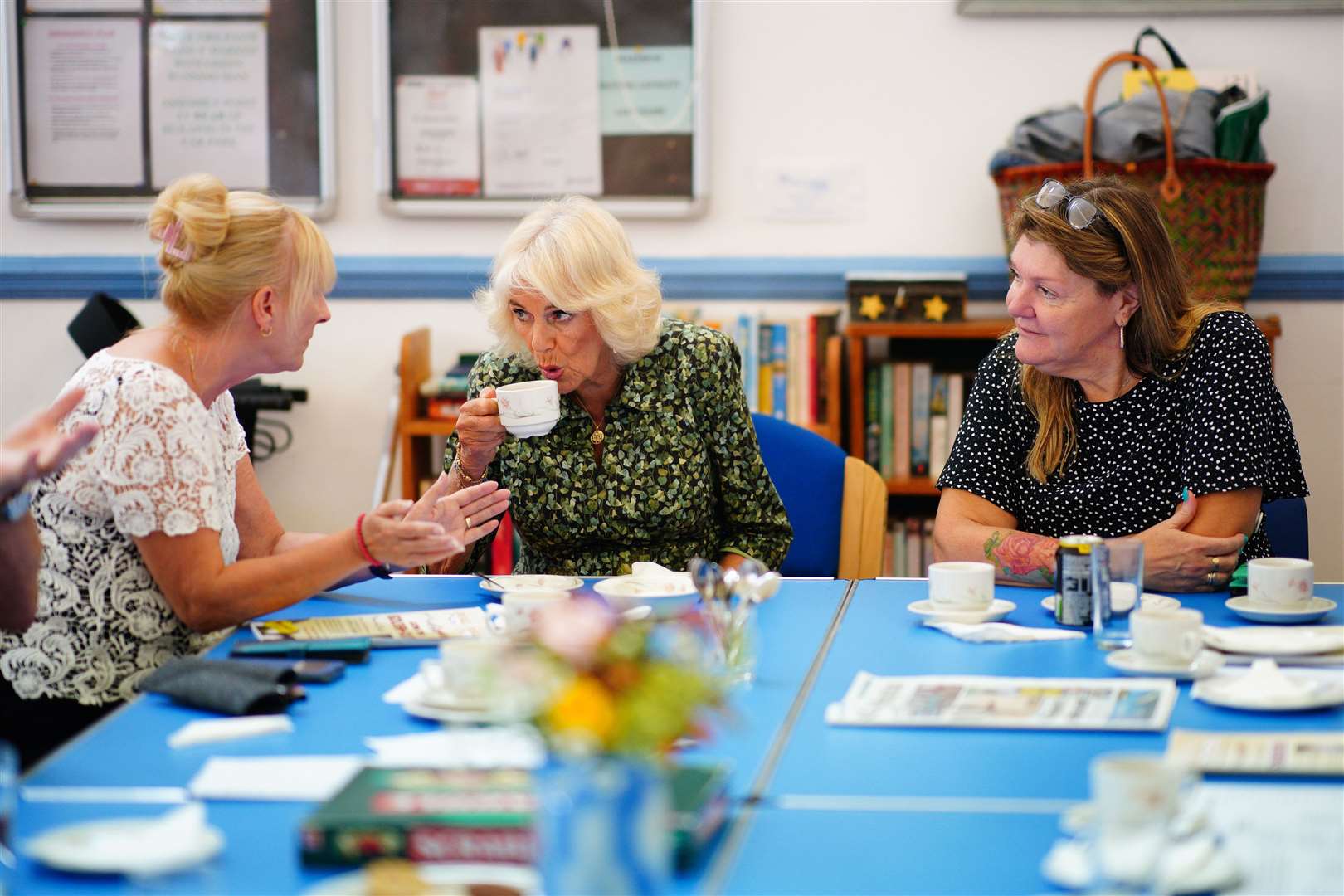 The Queen speaks to members of staff during a visit to the Oasis Centre at the Columba Centre in St Columb Major (Ben Birchall/PA)