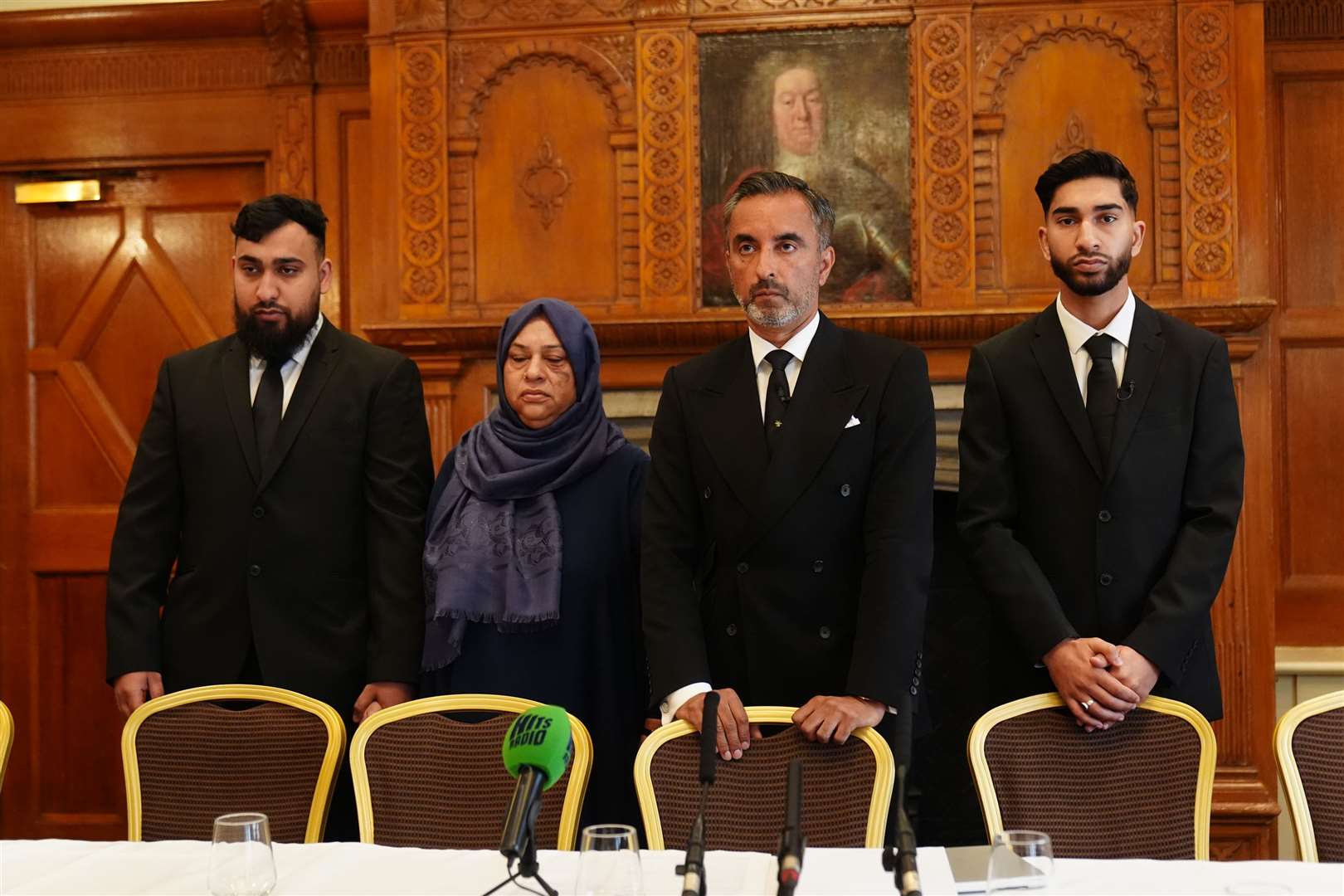 Solictor Aamer Anwar (second right) with brothers Muhammad Amaad (left) and Fahir Amaaz (right) and their mother Shameem Akhtar (Owen Humphreys/PA)